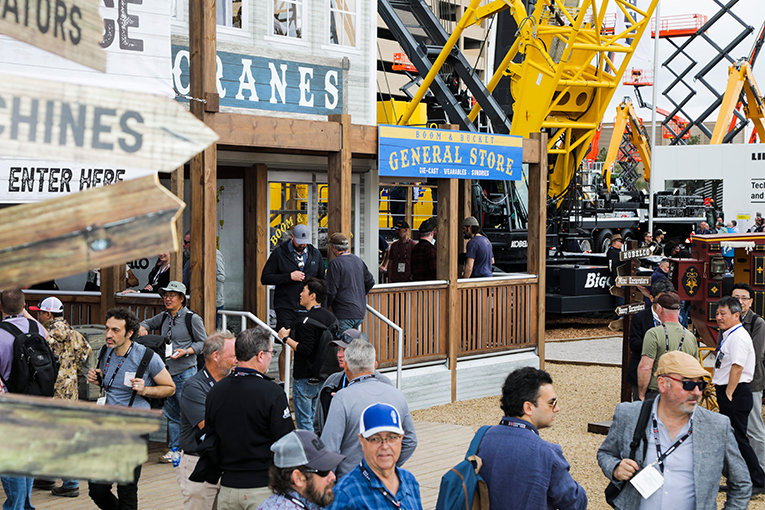 ConExpo attendees enter the main KOBELCO booth