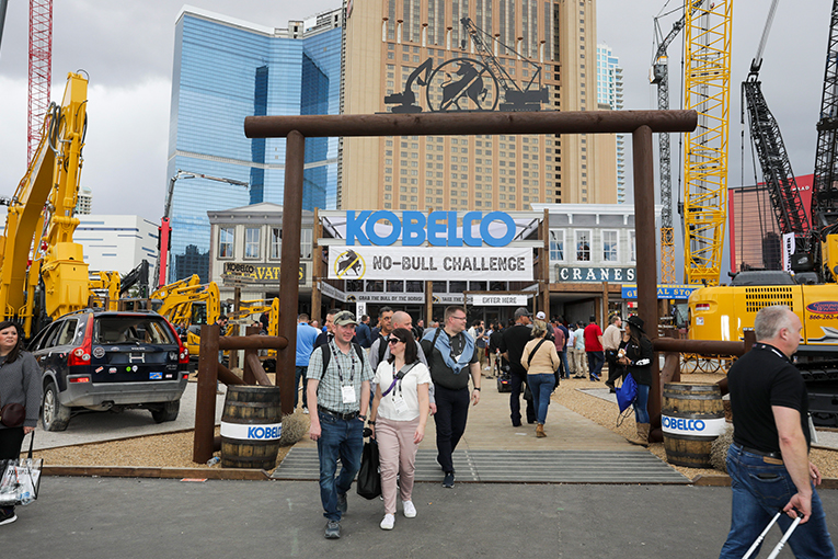 ConExpo booth attendees walk through the KOBELCO Ranch entrance