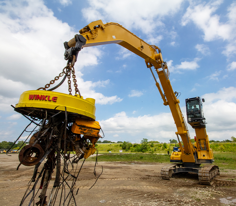 SK260DLC-11 with Scrap Loaded on Magnet